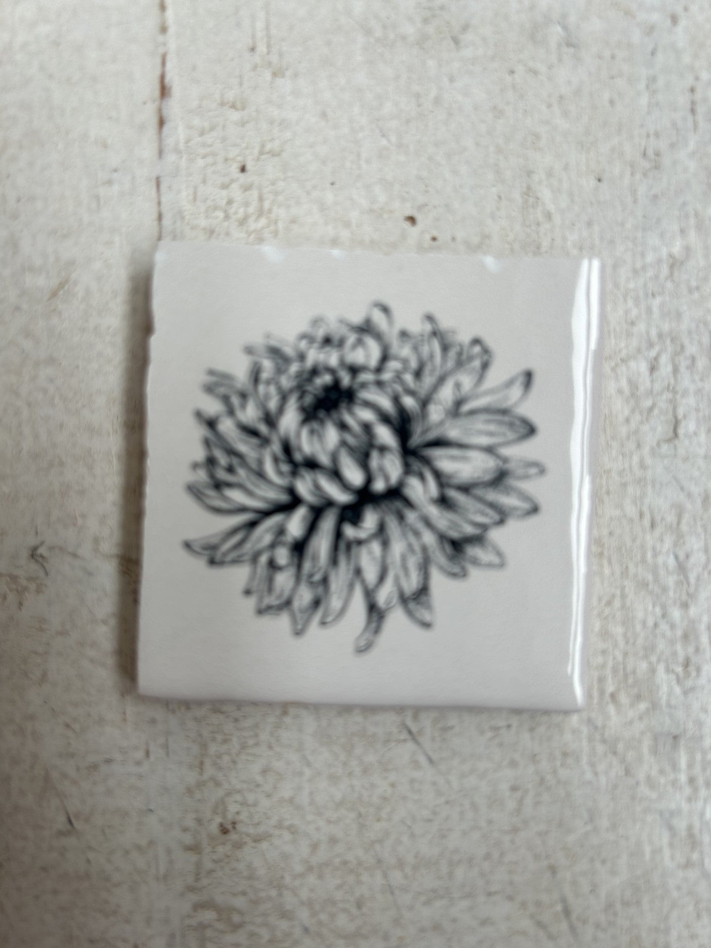 Lief tegeltje met een bloem