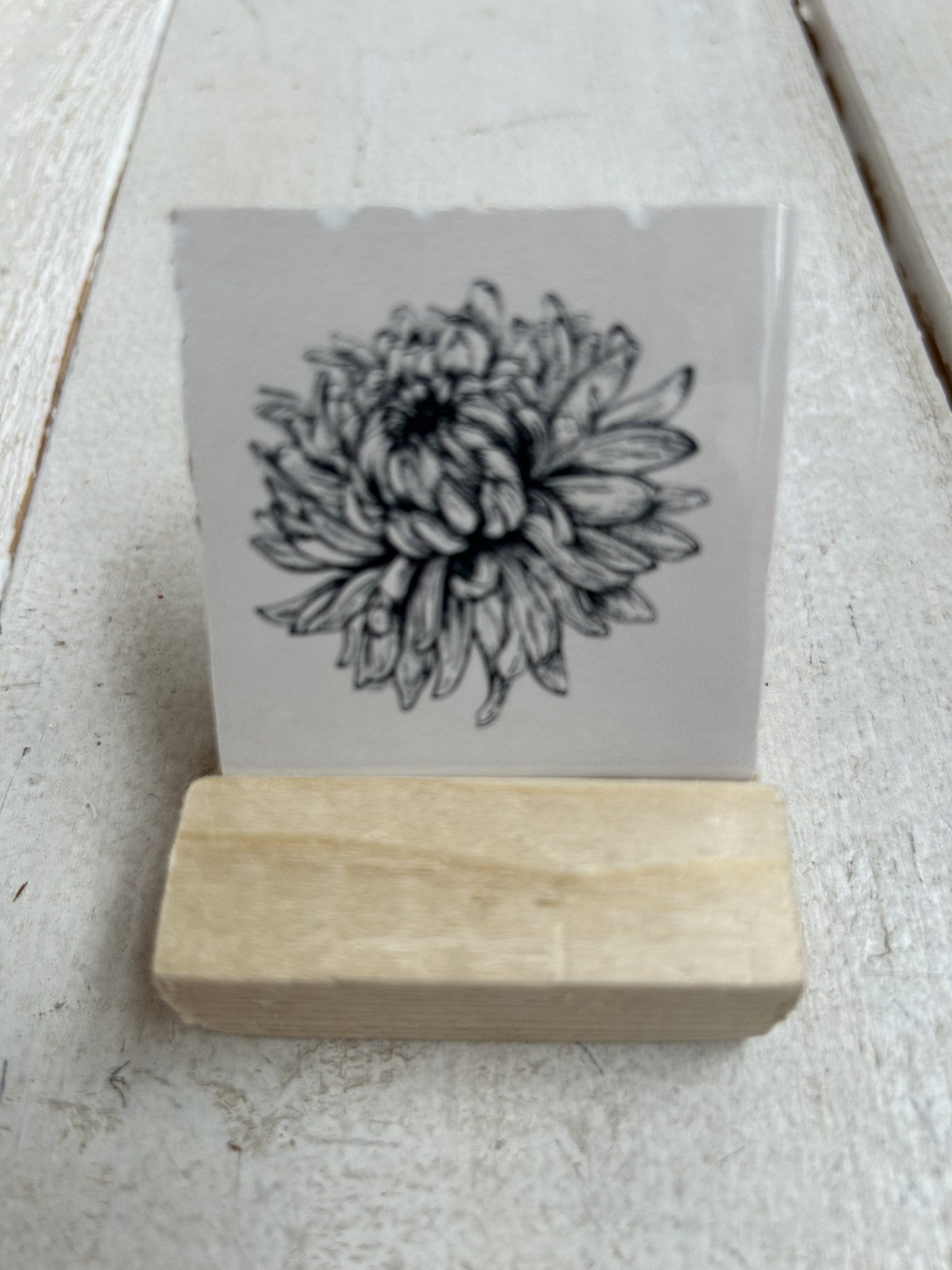 Lief tegeltje met een bloem